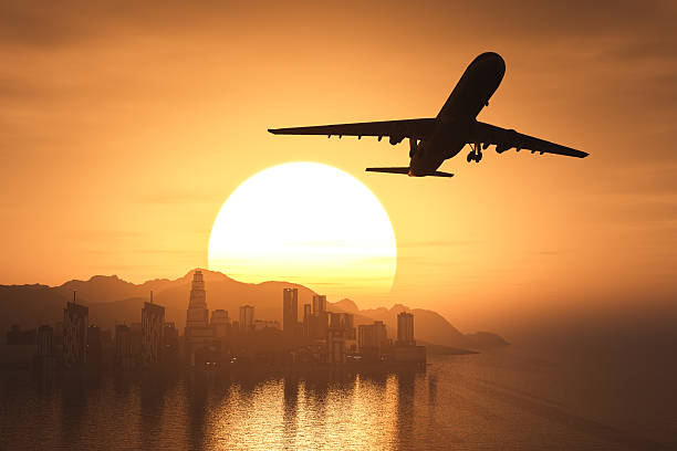 istock Airplane flying over the city and the beach 534056624