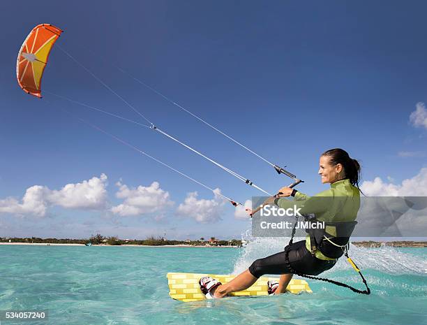 Kite Boarding Woman In The Caribbean Stock Photo - Download Image Now - Kiteboarding, Kiteboard, Women