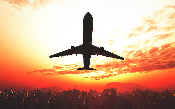istock Airplane flying over the city and the beach 534059246