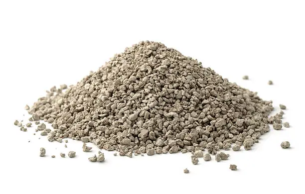 Pile of clumping cat litter isolated on white