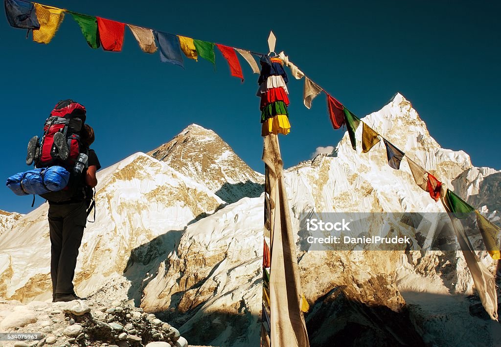 evening view of Everest evening view of Everest with tourist and buddhist prayer flags from kala patthar and blue sky - way to Everest Base Camp - Nepal Mt. Everest Stock Photo