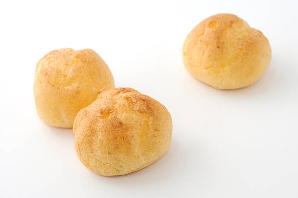 istock Cream puffs in a line isolated on white background 534076005