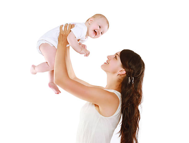 istock Happy mother and baby having fun on a white background 534076721