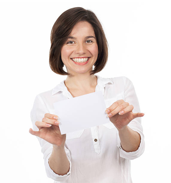 istock Joyful young woman showing a blank signboard 534082955