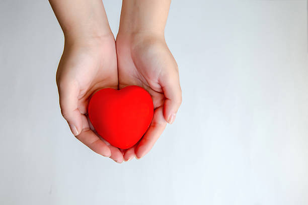 istock Hands holding red heart isolated 534085631