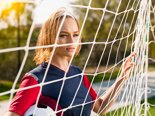 istock Soccer Babe By The Net 534086283