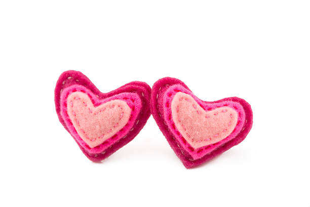 istock Pair of wool hearts with pink and red stripes on 534096963