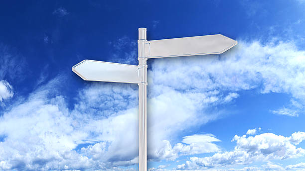 istock Two white arrow signs on the blue sky 534097559