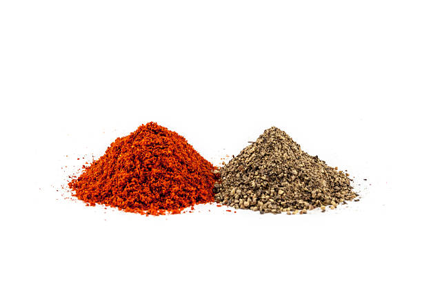 istock Two piles of grinded black and red pepper 534099017