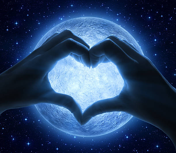 istock love and moon - romantic sign with hands 534099047