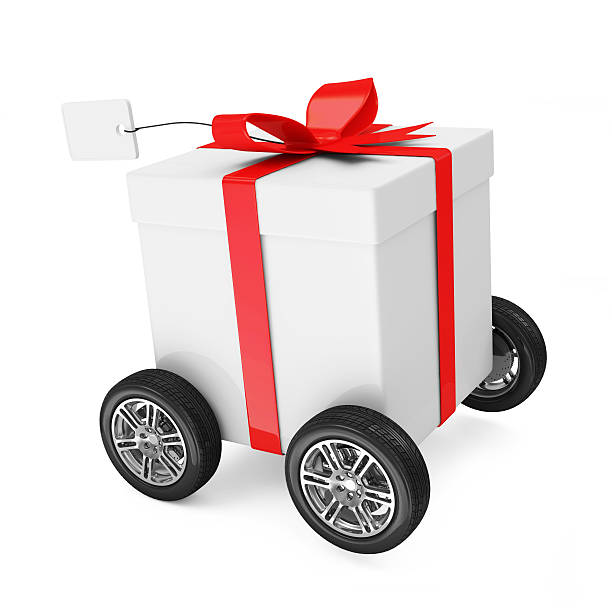 istock Gift Box with Red Ribbon on wheels 534099595
