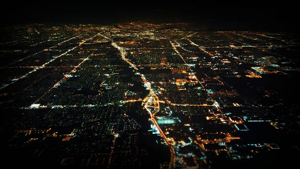 istock Aerial View Flying Over Anonymous City at Night 534100571