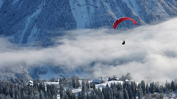 istock Paraglider and winter landscape 534102253