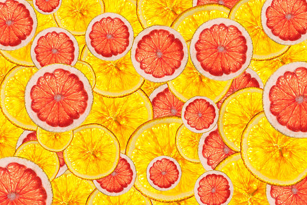 istock pink grapefruits and oranges mix colorful sliced fruits  backgro 534103547