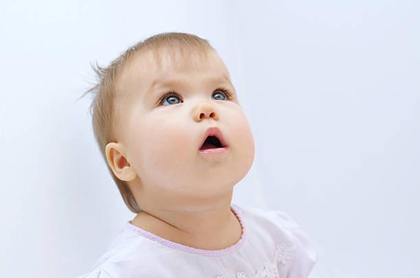 istock Baby girl looking up 534103615