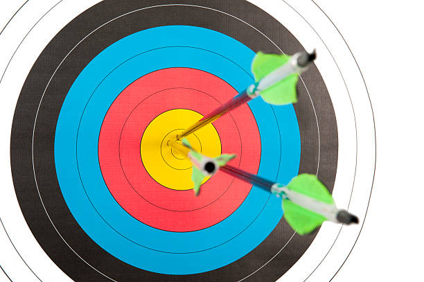 Archery target with three arrows stock photo