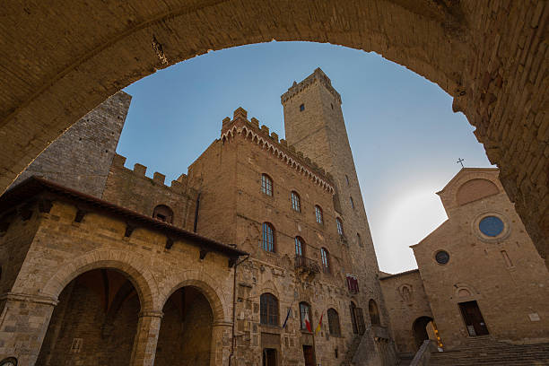 An Archway looking towards the Duomo of San Giminiano, Tuscany, Italy