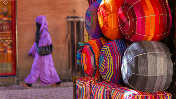 many african straw baskets on a market stand, with many colors and decorations
