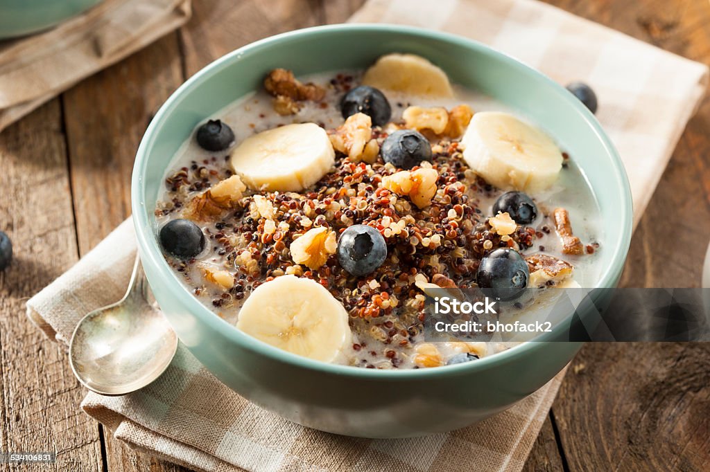 Organic Breakfast Quinoa with Nuts Organic Breakfast Quinoa with Nuts Milk and Berries Dietary Fiber Stock Photo