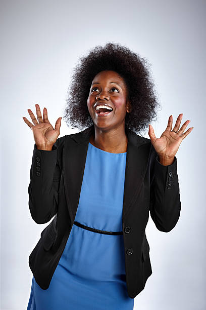 istock Mature african woman looking excited on white 534107091