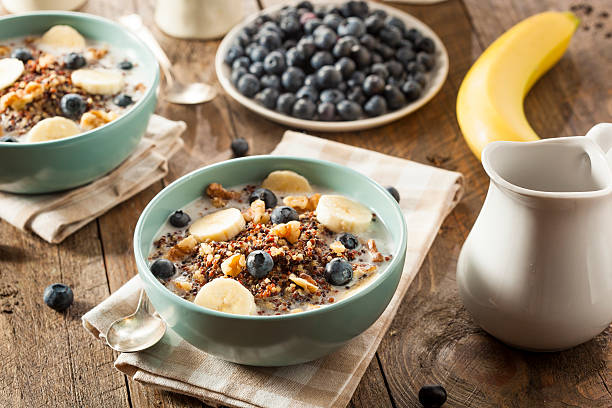 Organic Breakfast Quinoa with Nuts Organic Breakfast Quinoa with Nuts Milk and Berries dietary fiber photos stock pictures, royalty-free photos & images