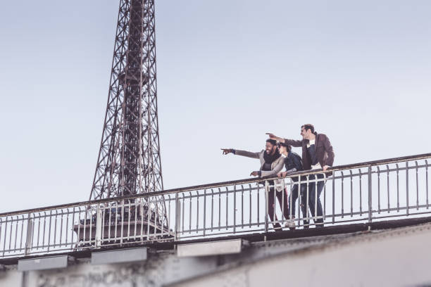 istock Multi-ethnic group of friends having fun in Paris along Seine 534108566