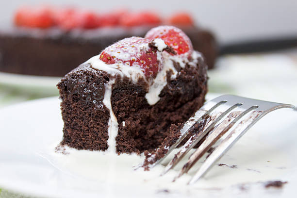 istock Slice of chocolate fudge cake covered in cream 534108606