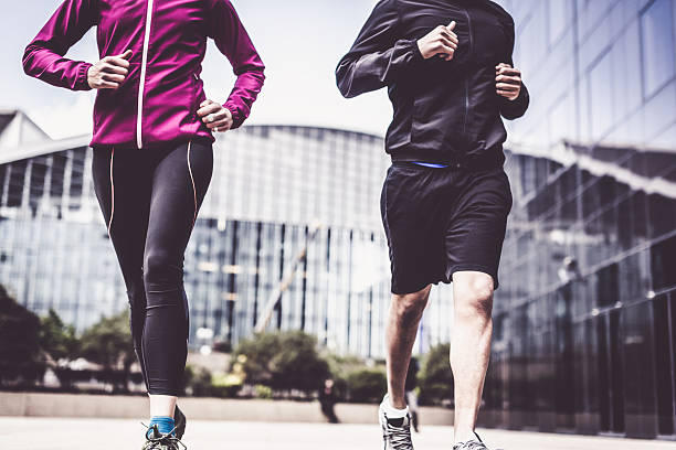 istock Multi-ethnic couple jogging in urban setting 534112392