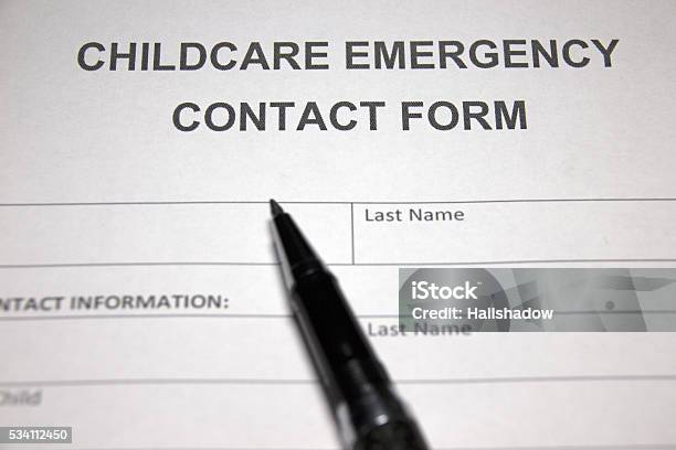 Someone Filling Out Childcare Emergency Contact Form Stock Photo - Download Image Now - iStock someone-filling-out-childcare-emergency-contact-form-stock-photo-download-image-now-istock