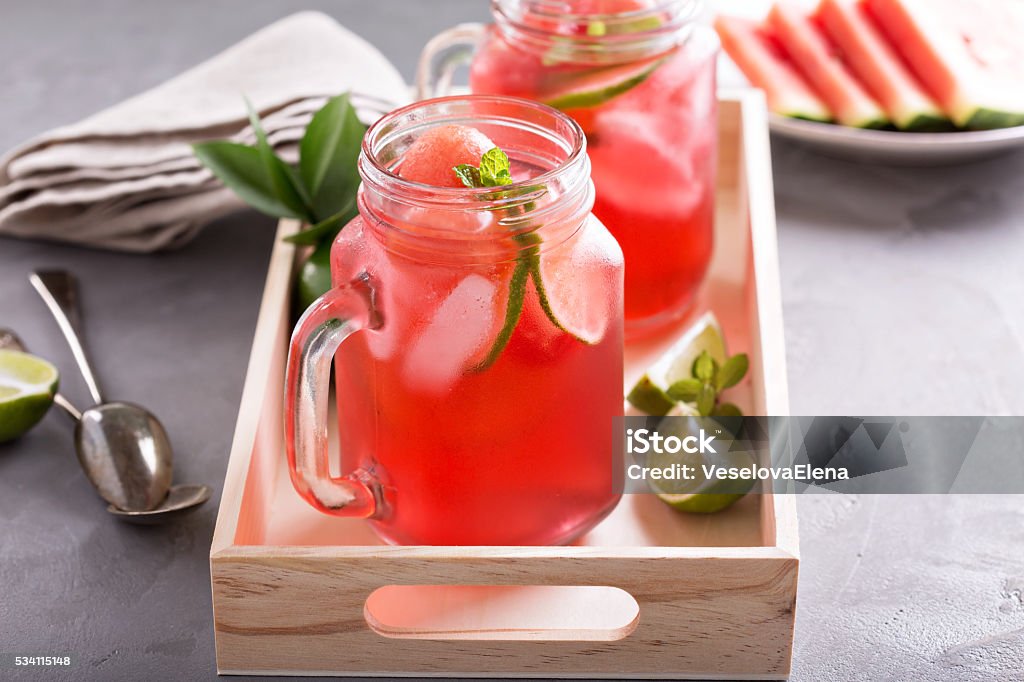 Watermelon and lime lemonade Watermelon and lime lemonade summer drink on a tray Berry Stock Photo