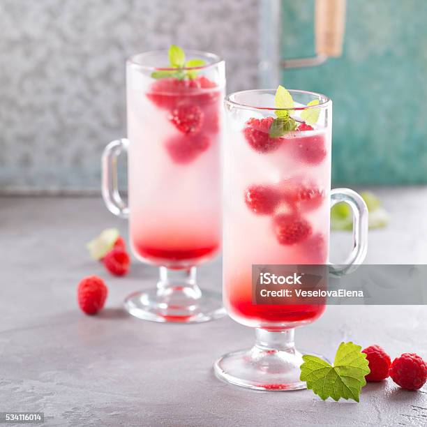 Pink Raspberry Lemonade In Tall Glasses Stock Photo - Download Image Now - Backgrounds, Berry, Close-up