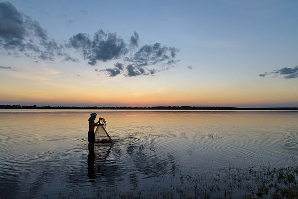 istock silhouette fisherman 534117448