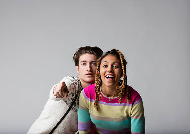 boy and girl posing during a party making fools