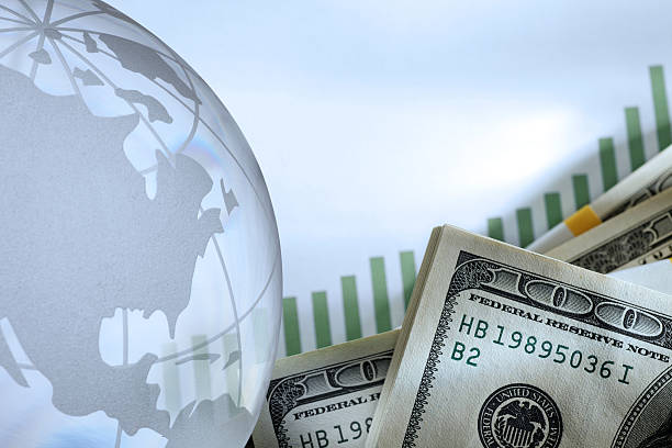 istock Globe And Stack Of Money On Top Of Chart 534117992