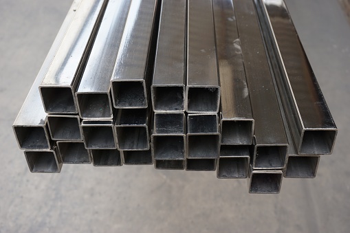 stack of square stainless steel tube in warehouse
