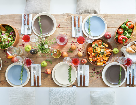 Healthy food such as salad, vegetables, fruits on the served table