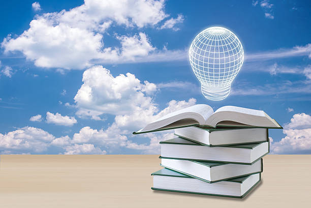 istock education concept,lamp over open book with sky clouds 534125732
