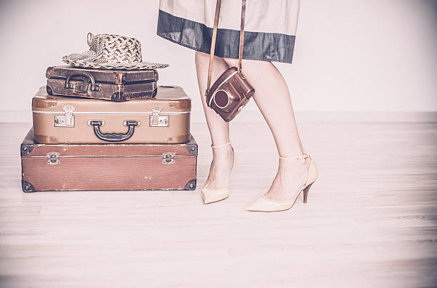 istock Woman standing beside suitcases 534125760
