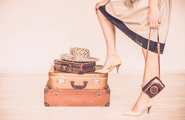 istock Woman standing beside suitcases 534125944