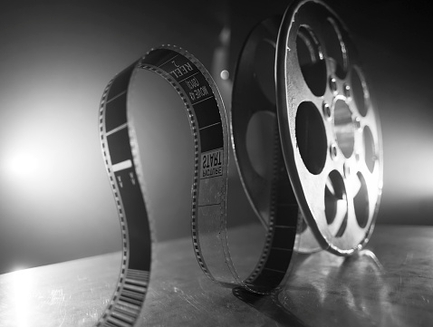 Reel of film on a black-white background