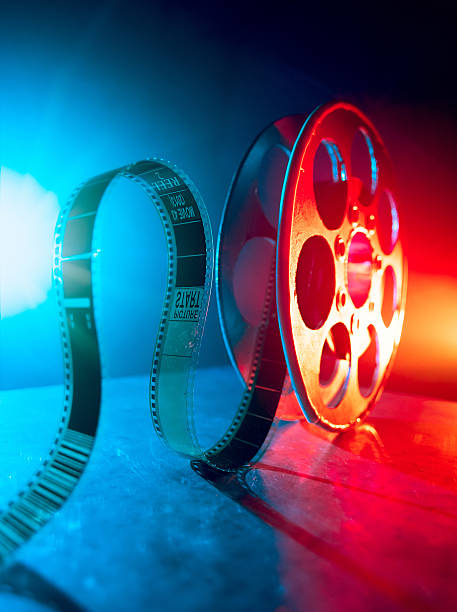Reel of film Red reel of film on a dark background spool photos stock pictures, royalty-free photos & images