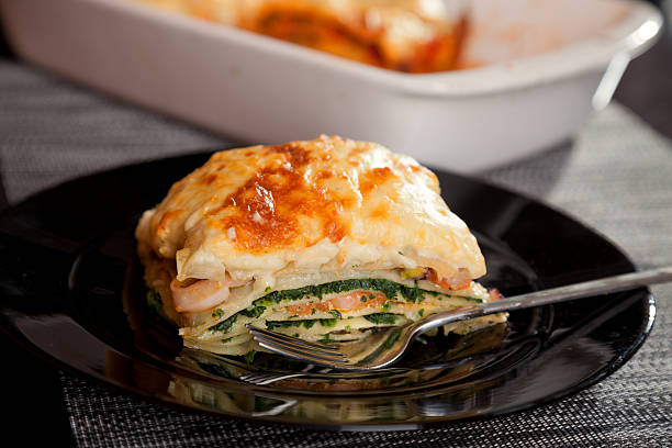 Lasagne with spinach and salmon stock photo
