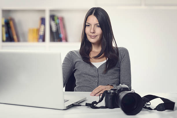 istock Photographer smiling in satisfaction at her images 534130797
