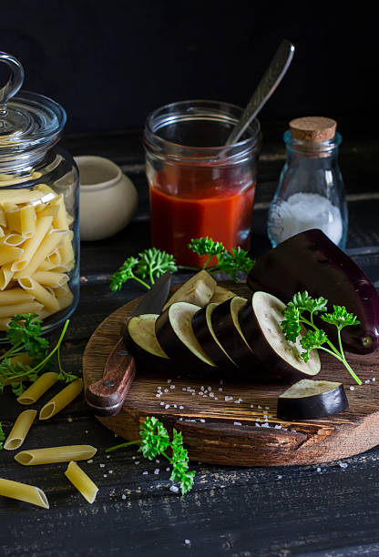 istock Penne pasta, eggplant, onion, tomato sauce, spices and herbs 534131218