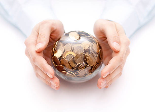 istock Crystal ball with money in hands 534131237