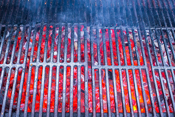 istock Empty black cast iron grill with hot red glowing coals 534132041