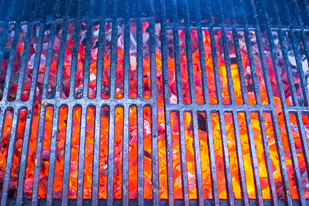 istock Empty black cast iron grill with hot red glowing coals 534132049