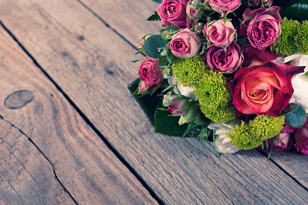 istock Bunch of Flowers on Wood Table 534132394