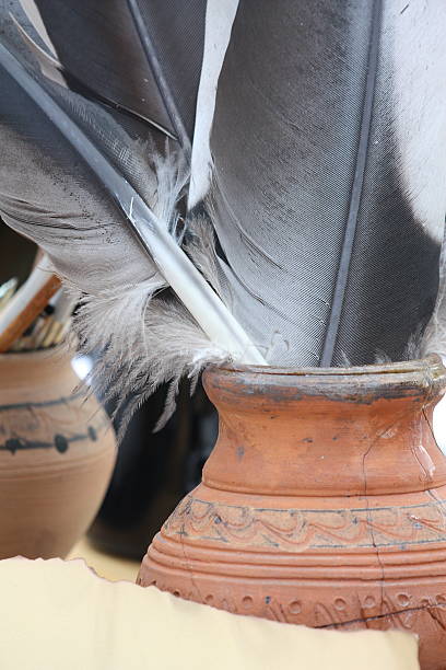 istock Close up of old parchment and jar with quills 534132855