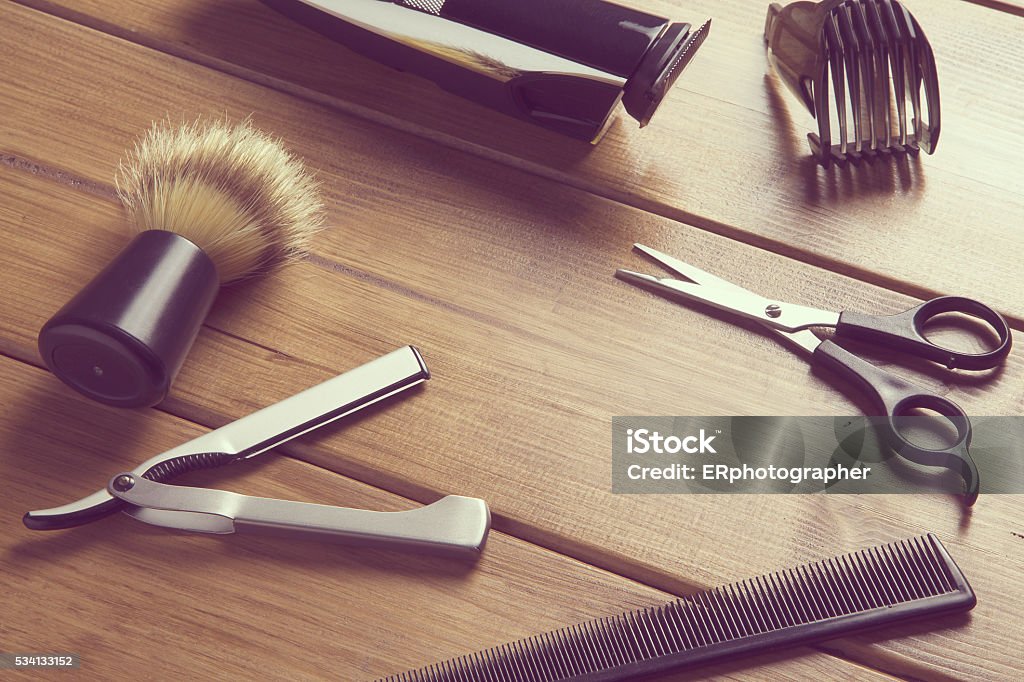 essentials tools for barber portrait of barber tools on wood top Hair Salon Stock Photo